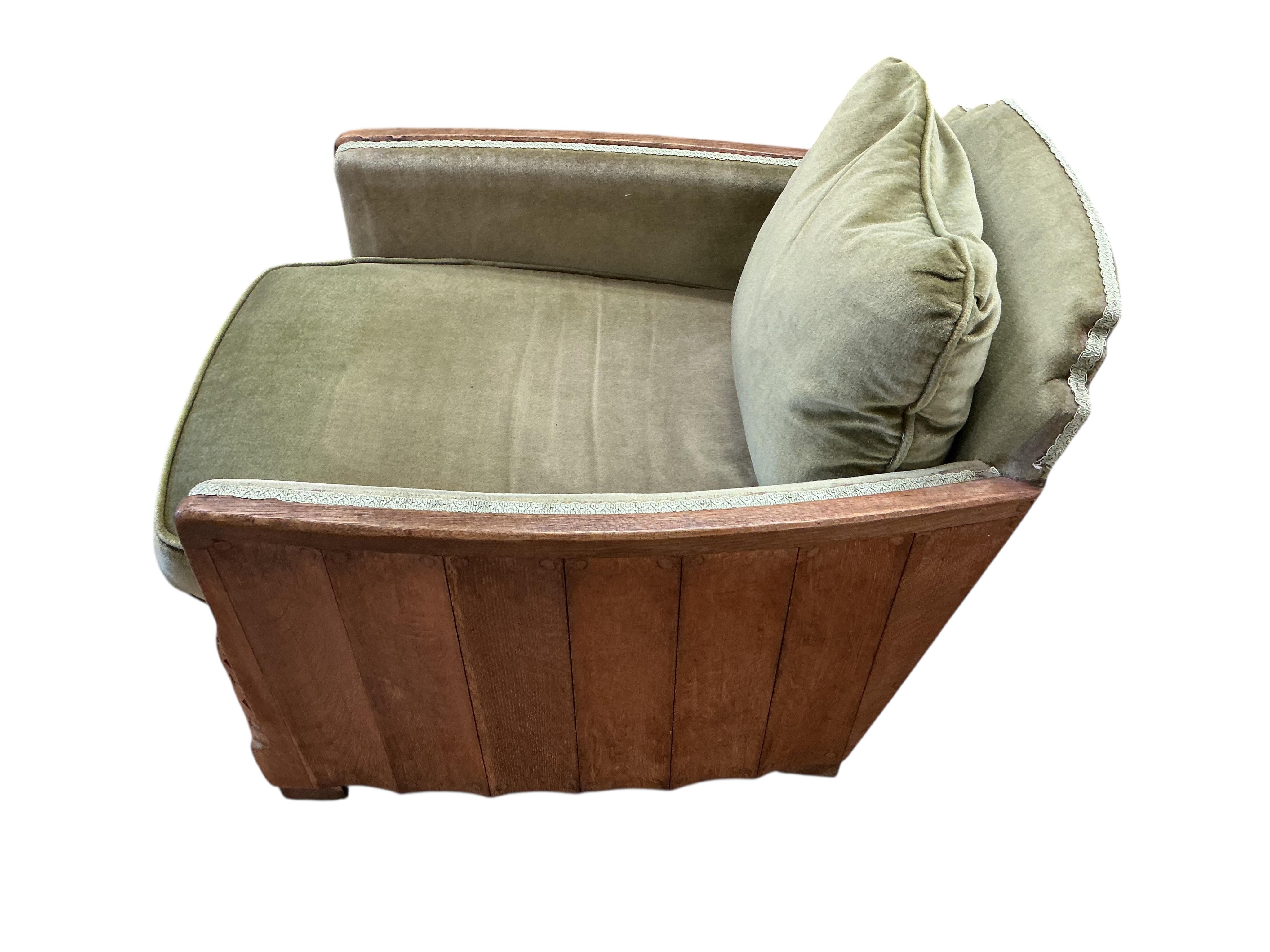 A pair of French Art Deco oak armchairs, width 69cm, depth 90cm, height 69cm